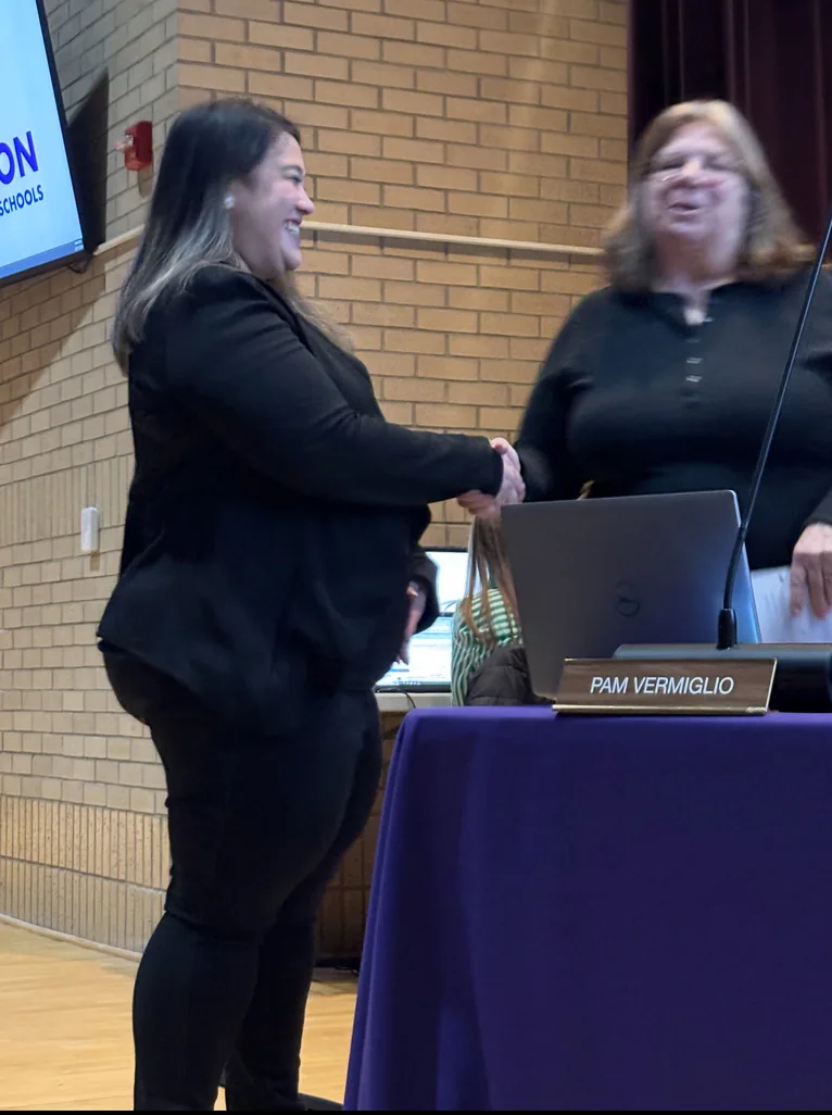 Missy Dodge at a school board meeting ceremony