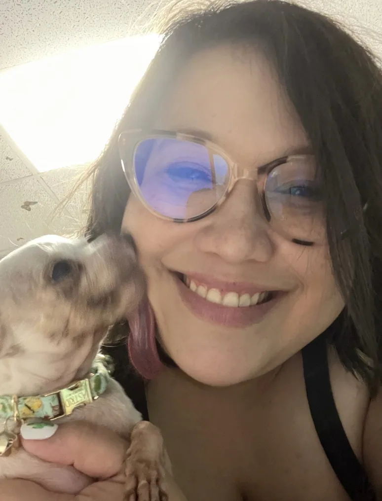 Missy with a Chihuahua giving her a kiss