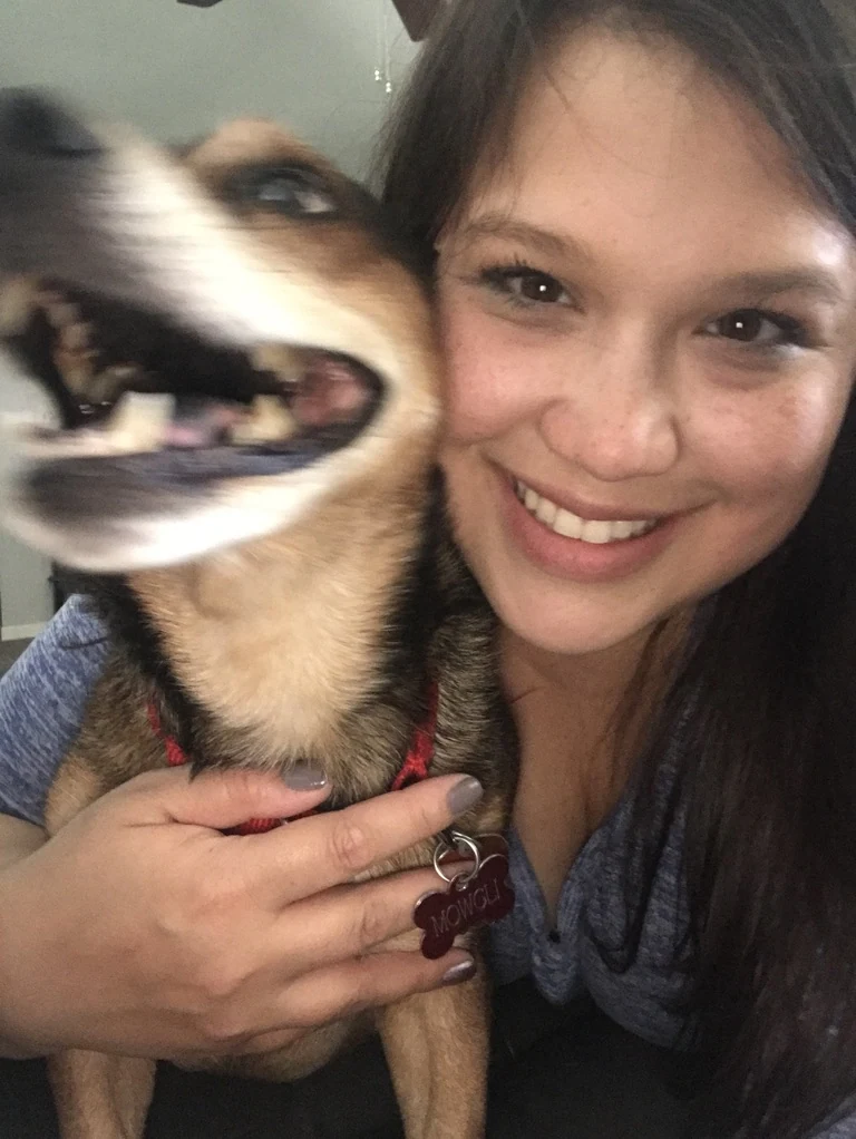 Missy and a tan and black dog posing together