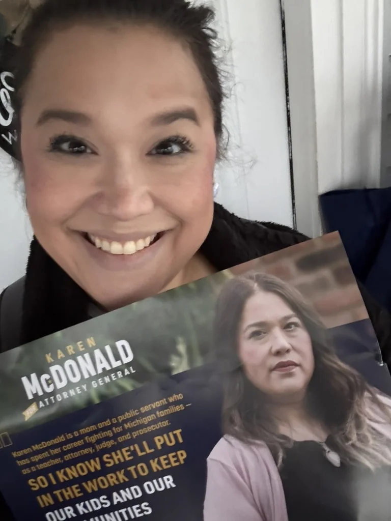 Missy holding an education-focused Karen McDonald campaign mailer