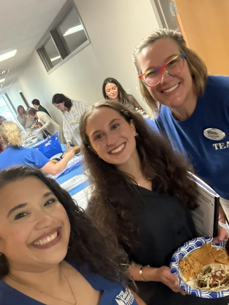 Missy with a former student who is now a district teacher and an adult colleague at August 2026 New Teacher Orientation